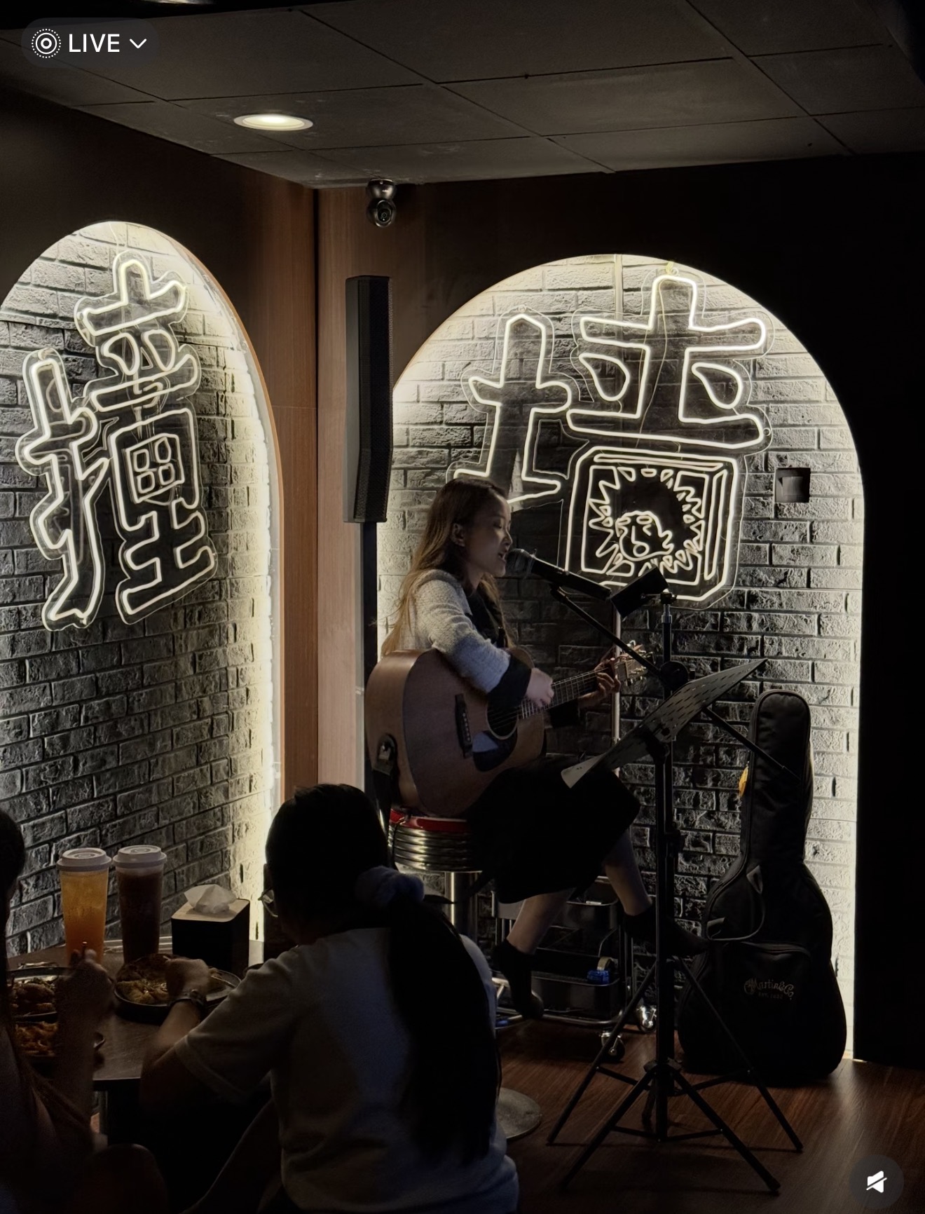 Live band with neon signs